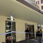 Three fugitives flee after crashing vehicle into upscale Brisbane boutique.