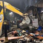 Controversial structures tied to suspects razed following confrontation during parade