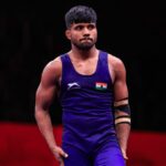 Wrestler Lalit falls short in championship match, but coach finds optimism in silver medal finish.