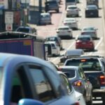 Minister raises concerns about road user tax potentially hindering electric vehicle adoption.